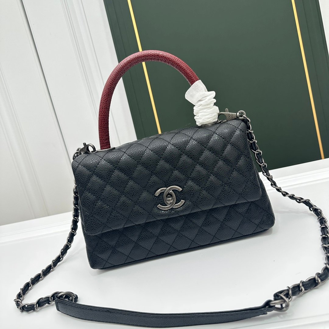 4ef10a540de90df5bc7f7cc2dd2d1874f68a44c615f1650533d916f422bb5e2e Chanel Mini Coco Red Handle Flap in Black With Silver Hardware - Bag - Image 1