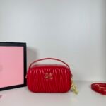 Miu Miu Logo Patch Zipped Clutch Bag