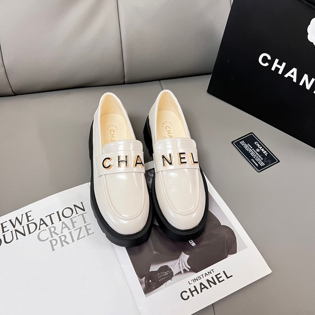 ae36b33f40a094b1efe9c09a7edaa9dc Chanel Alphabet Buckle Loafers-White - Image 1