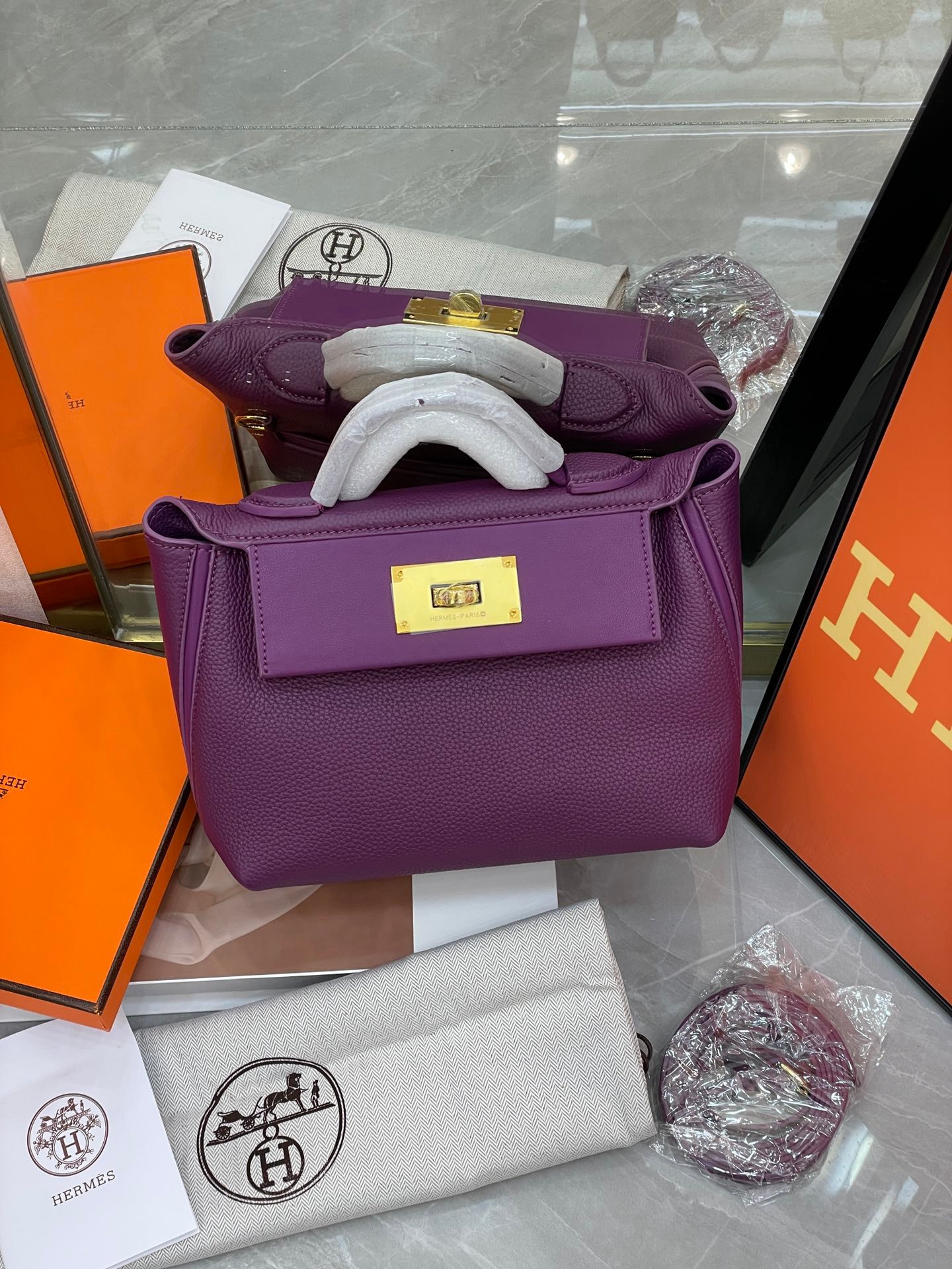 faf5b565b6feea8595b698984a8cc81e Hermes 2424 Togo Swift Gold Hardware Purple - Bag - Image 1